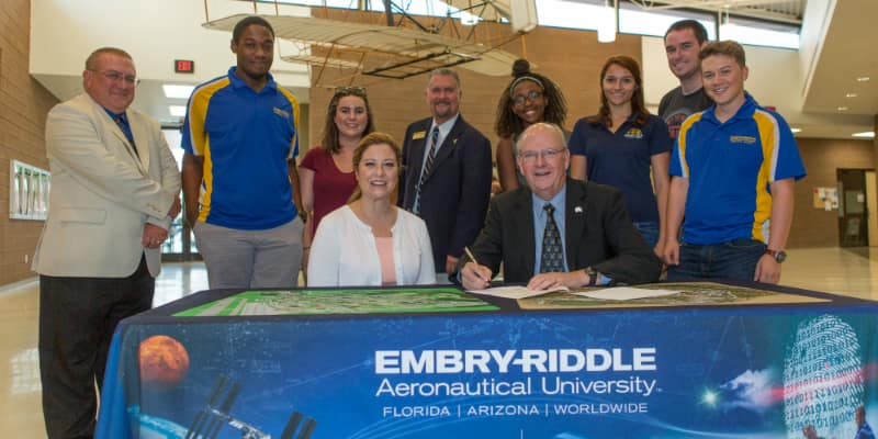 Prescott Campus Chancellor Frank Ayers signs the agreement with Ameriflight