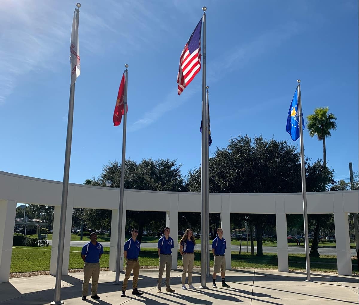 Cadets Marcell Gilliam, Doug Nguyen, Robert Kramer, Sarah Poole, and Ryan Bowen stand among the symbols of those who have come before them.” (Photo: Embry-Riddle/Olivia Shumbo)