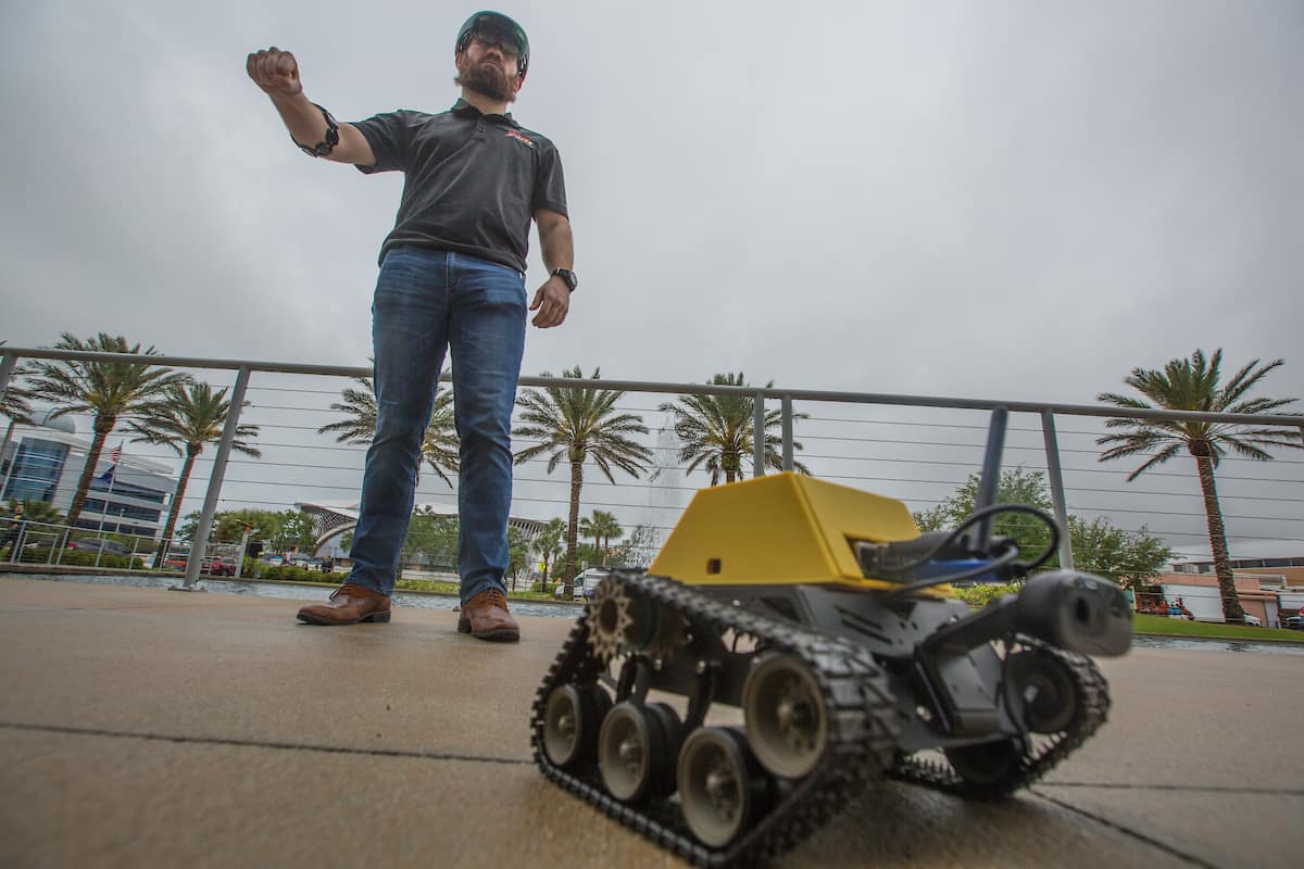 Adam Berlier demonstrates new wearable technology system to operate remote vehicles while maintaining situational awareness.