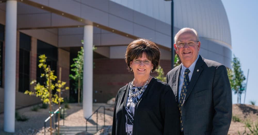 Chancellor Dr. Frank Ayers stands with his wife, Debbie, in front of the STEM Education Center at its grand opening in 2017