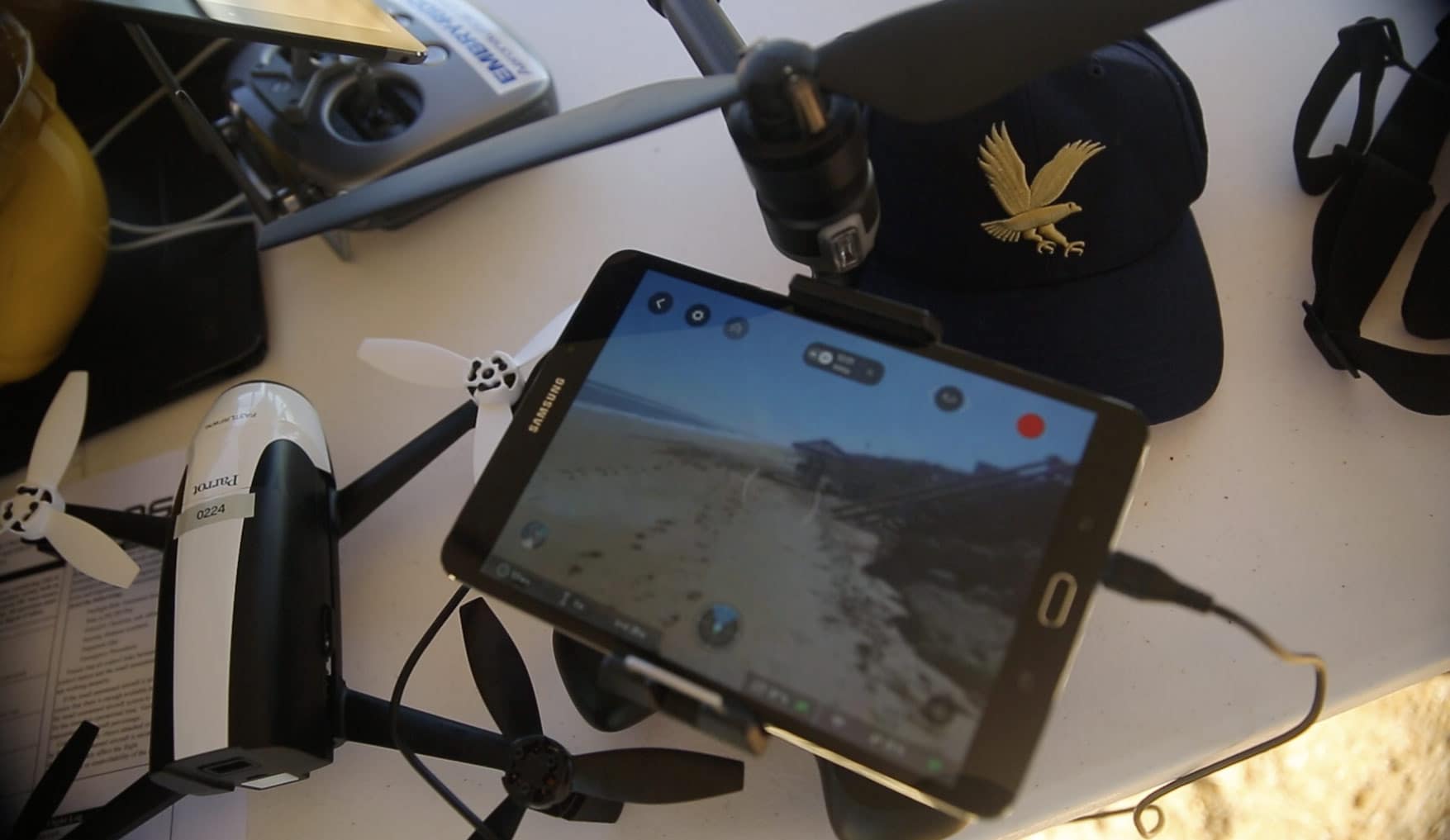 a drone, iPad and Embry-Riddle branded hat