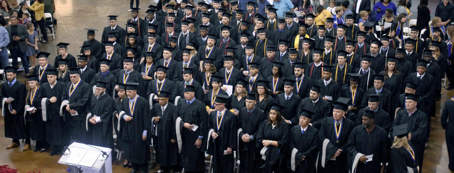 Students graduate at a Worldwide commencement in 2018. Photo Credit: Embry-Riddle Aeronautical University