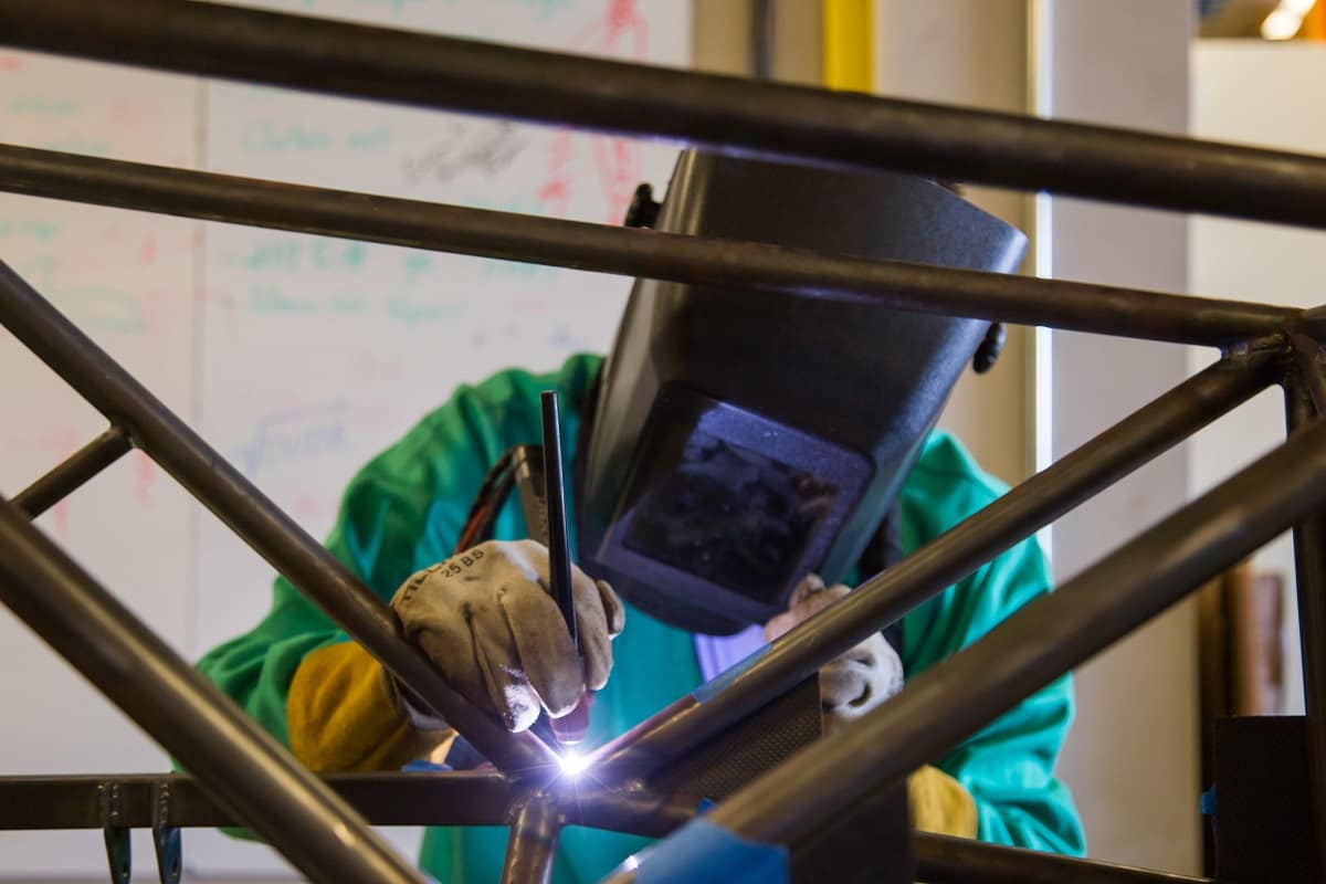 Embry-Riddle student welds the Formual SAE car