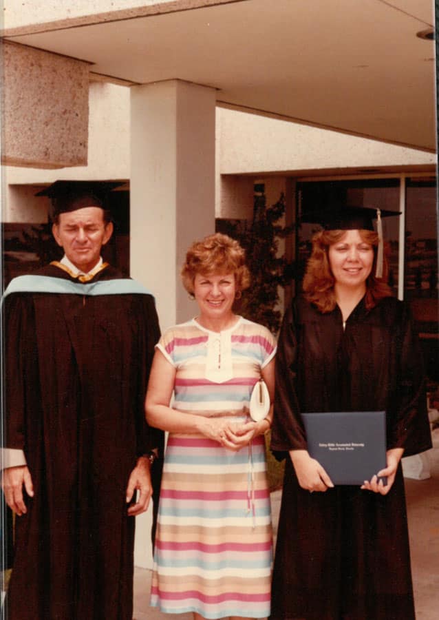 Chris Ison with dad Prof. Otis and mom Nora at graduation. Photo provided.