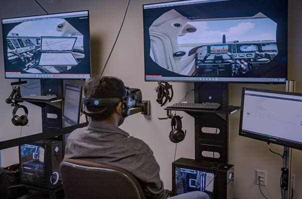 On a system in Embry-Riddle’s Preflight Immersion Lab on the Daytona Beach Campus, a student practices radio communications by interacting with AI-driven air traffic control and pilots.