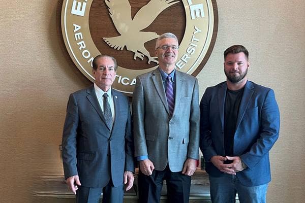 Embry-Riddle President P. Barry Butler (center) stands with Florida Senator Tom Wright (left) and USNDA President Nathan Ecelbarger (right)