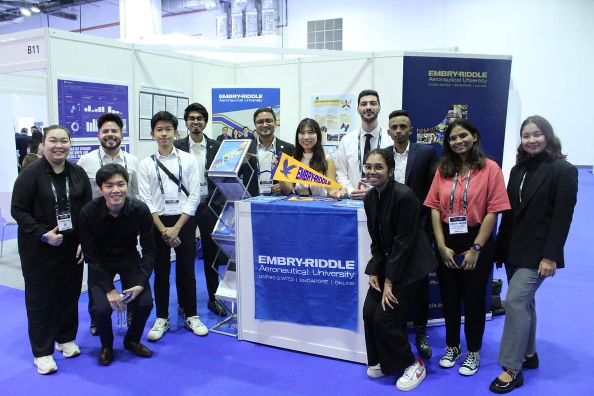 Embry-Riddle researchers and Associate Vice-Chancellor Pablo Alvarez (back row, second from left) show off their Eagle pride at the FTE show. (Photo: ERAU Asia Photography Club)