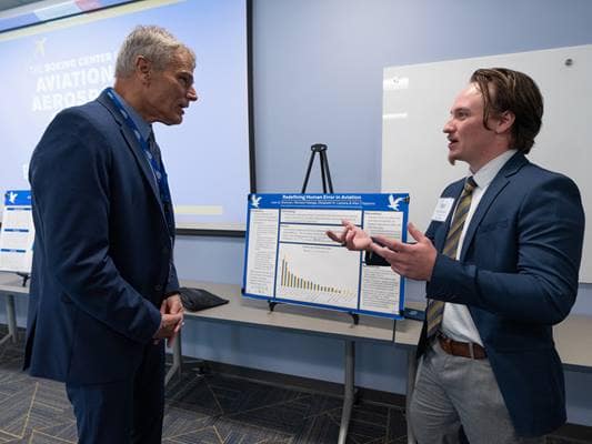 Liam Brennan, who is pursuing a Ph.D. in Human Factors, presents his research poster at  the Boeing Center for Aviation and Aerospace Safety’s second annual Safety Research Symposium.