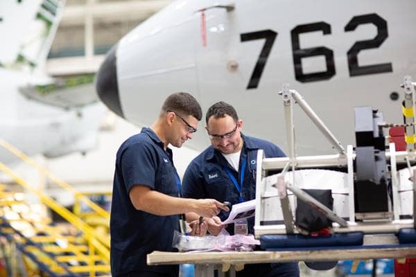 Men working on an airplane.