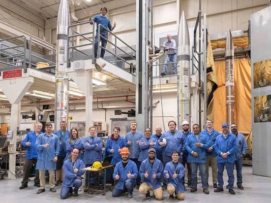 NASA and Embry-Riddle researchers pose with three sounding rockets that are part of the APEP (Atmospheric Perturbations around Eclipse Path) mission.