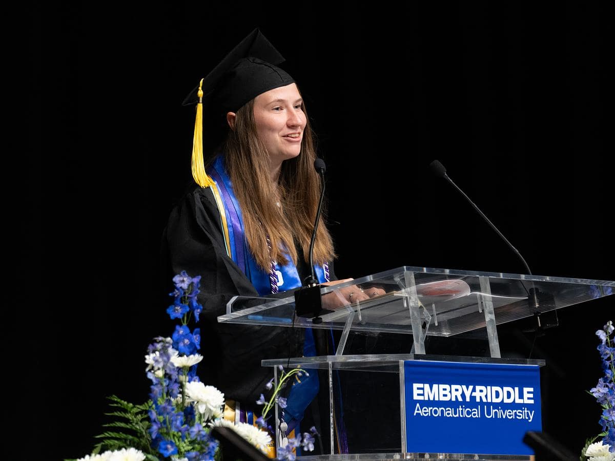 Woman gives commencement speech.