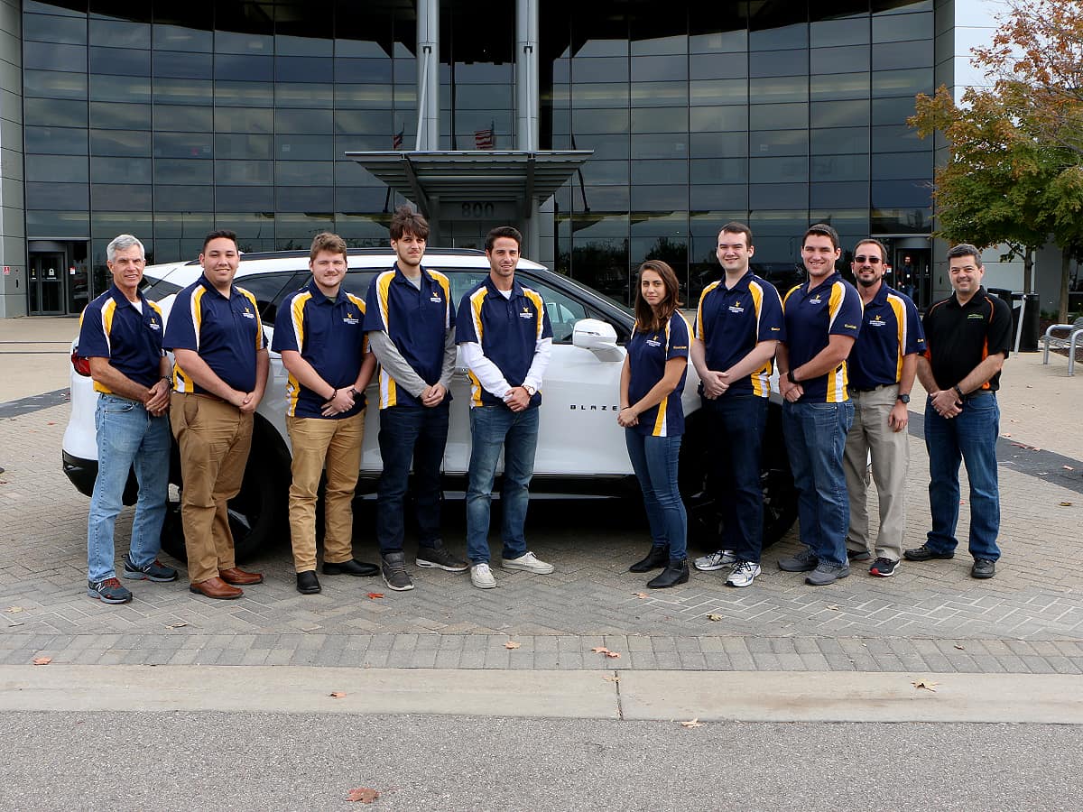 Some members of the Embry-Riddle Aeronautical University team at the EcoCAR Mobility Challenge Fall Workshop in Michigan with the 2019 Chevrolet Blazer.