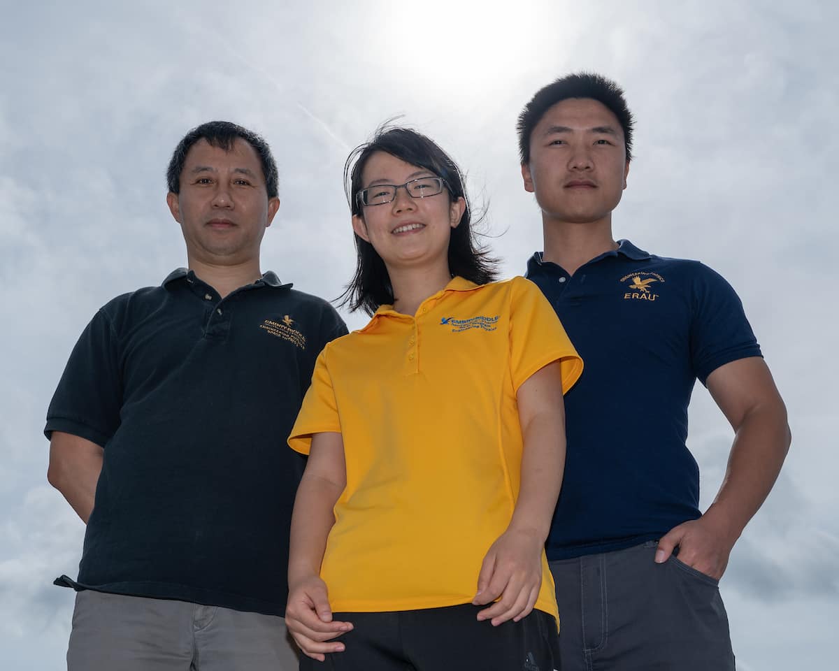 Dr. Alan Liu and his students Zishun Qiao (yellow shirt) and Fan Yang (blue shirt) will use data collected during an upcoming solar eclipse to study how atmospheric gravity waves propagate upward from the troposphere, becoming large enough to cause perturbations in the mesosphere. Photo: Embry-Riddle/Daryl LaBello