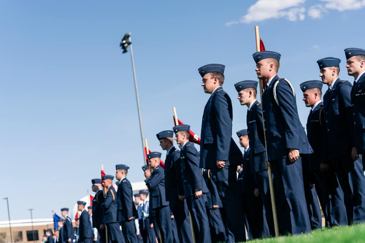 members of the rotc on a field