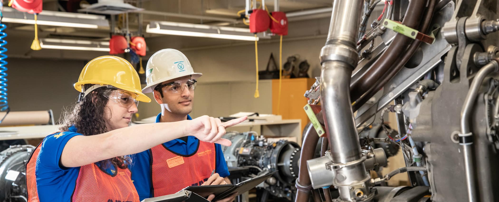 Students in the Masters of Science in Occupational Safety Management degree program inspect aircraft engine maintenance areas at Embry-Riddle Aeronautical University's Daytona Beach Campus, December 19, 2018.  (Embry-Riddle/David Massey)