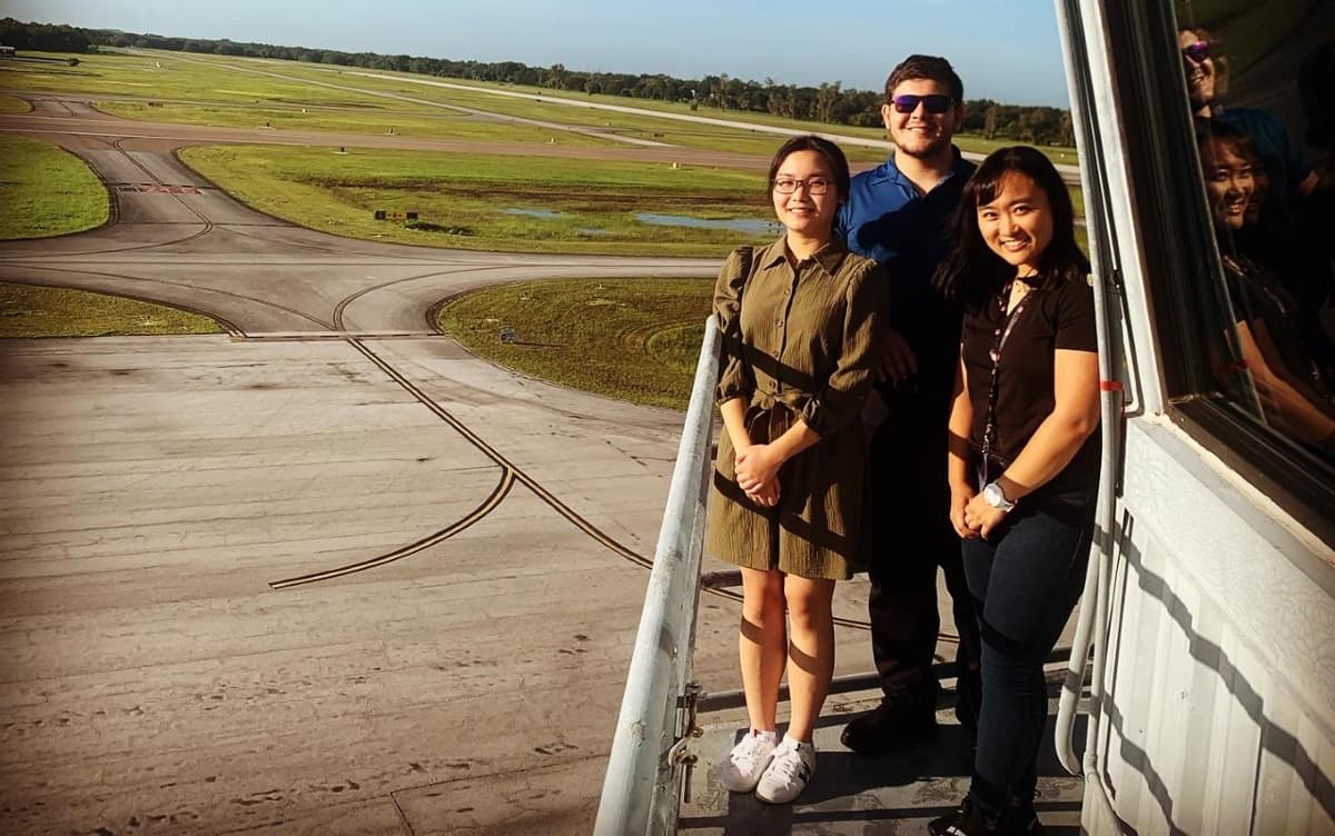 ERAU interns near a runway.