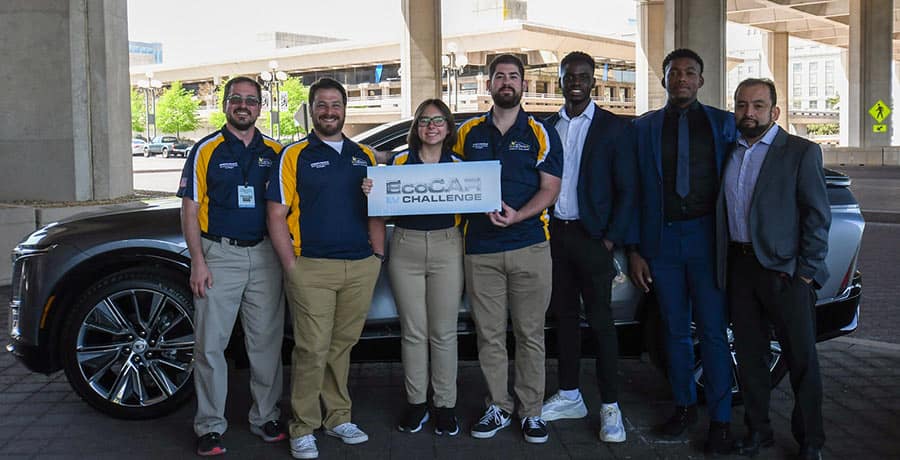 Embry-Riddle EcoCAR team stands by the car.