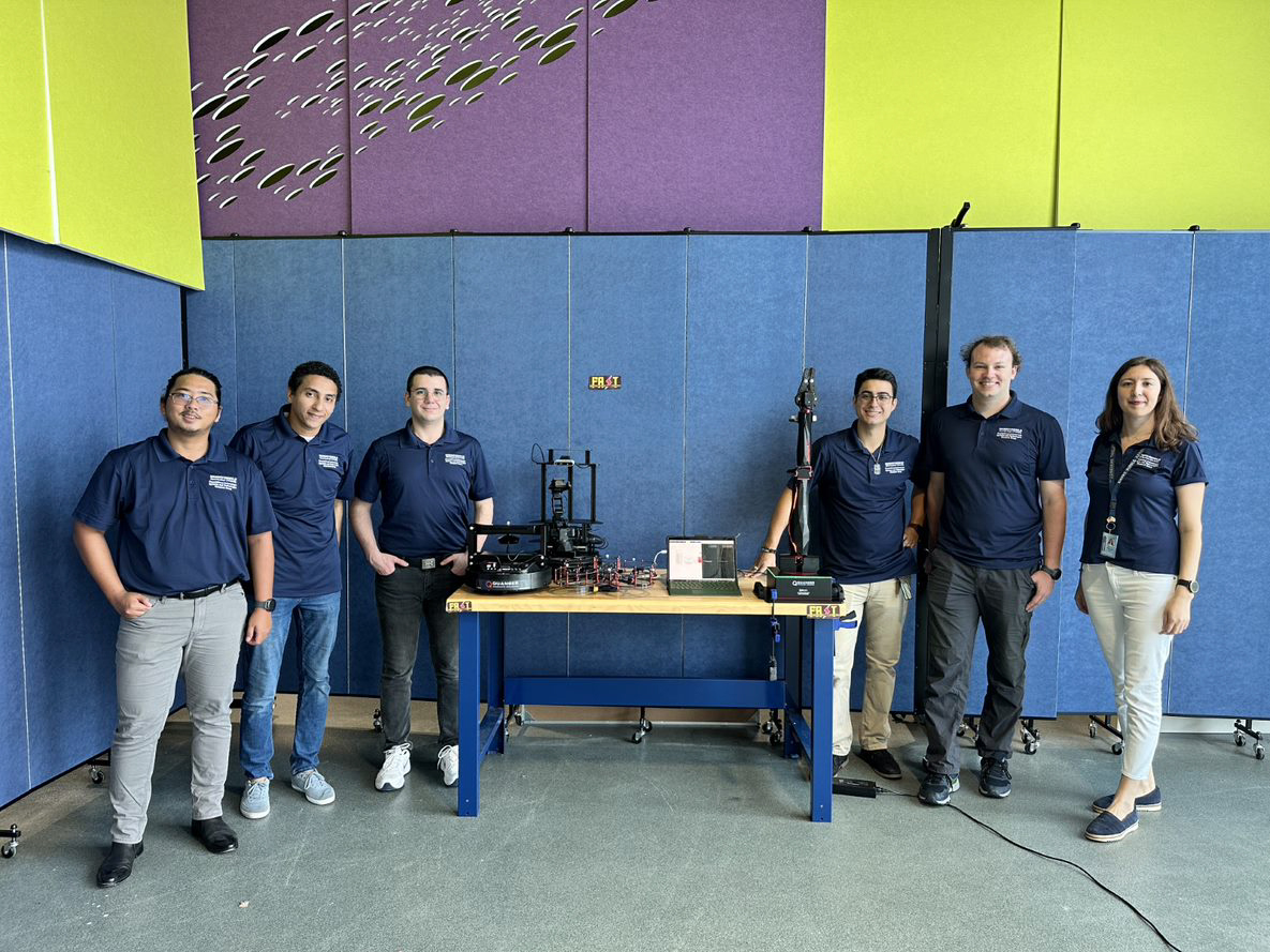 Embry-Riddle students participating the research project post with Dr. Merve Dogan (right)  in the FAST (Foundational Autonomous Systems & Technologies) lab.