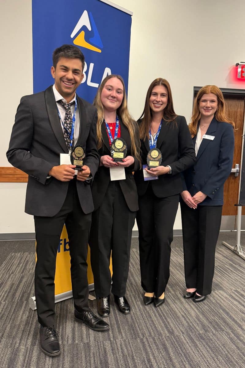 Embry-Riddle Aeronautical University students Carter Navulur, Autumn Cooper and Chloe Hovious pose with Arizona FBLA Collegiate State President Campbell Augustinovich at the 2026 State Leadership Conference. 