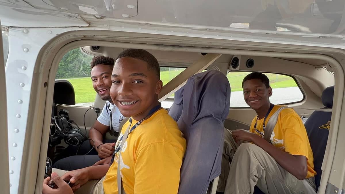 Embry-Riddle flight instructor Daniel Buchanan takes two teens in OBAP’s Aerospace Career Education Academy on an introductory flight