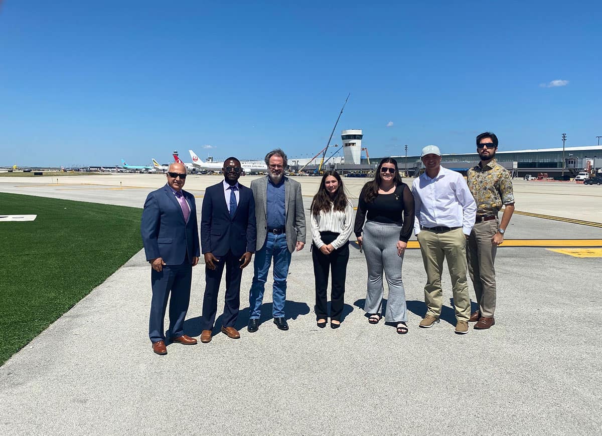CBSI faculty and staff behind the scenes at O’Hare International Airport. Left to right: Javad Gorjidooz, Dr. Jules Yimga, Tom Foley, Faith Vasquez, Ashleigh Cook, Mark Soerheide and Tristen O'Neal.