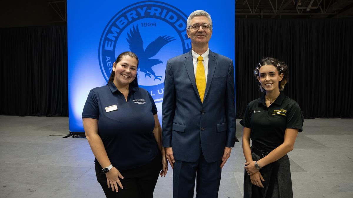 President Butler poses with students.