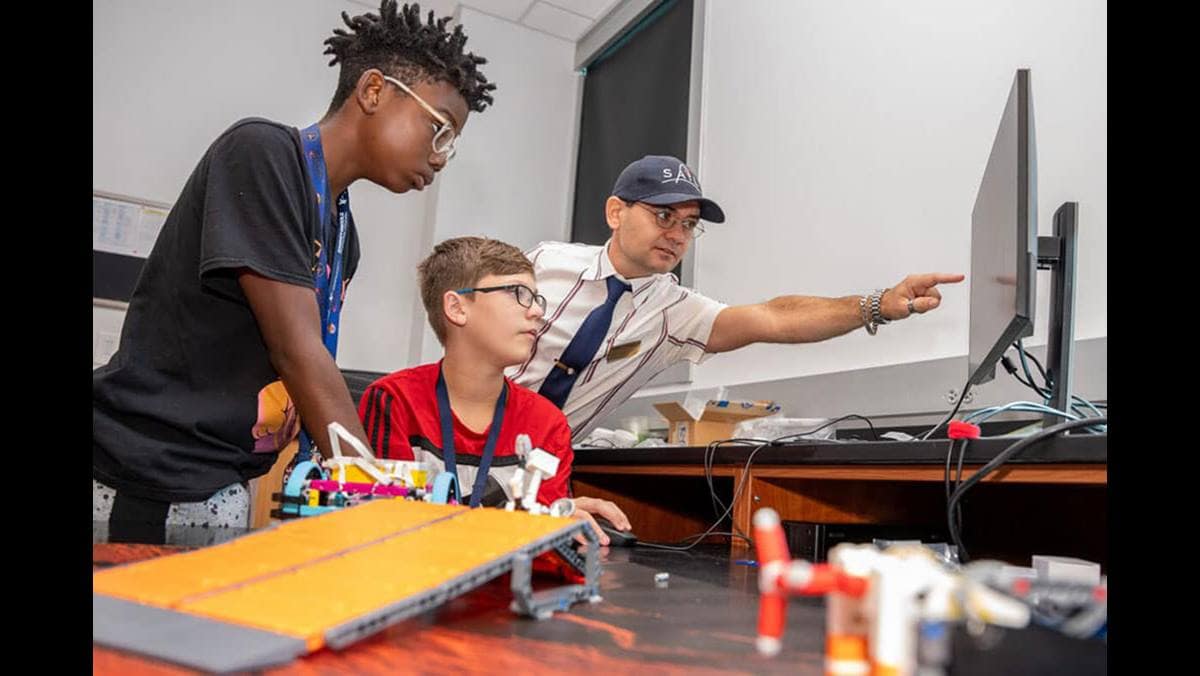 Dr. Jeremy Riousset worked with middle schoolers at a summer camp that introduced them to programming and space science