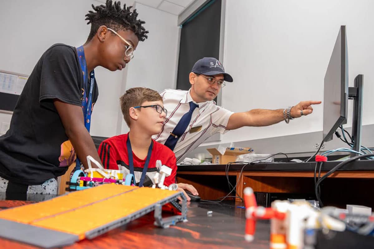 Dr. Jeremy Riousset worked with middle schoolers at a summer camp that introduced them to programming and space science