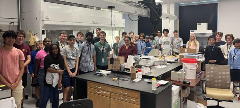 Embry-Riddle students Rohan Joshi and Forrest Dohner (first and second from left) in Dr. Foram Madiyar’s lab