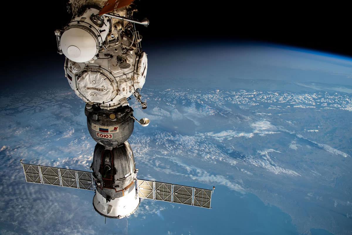 In this photo (from bottom to top), the Soyuz MS-25 crew ship is pictured docked to the Prichal docking module, which is attached to the Nauka science module of the International Space Station