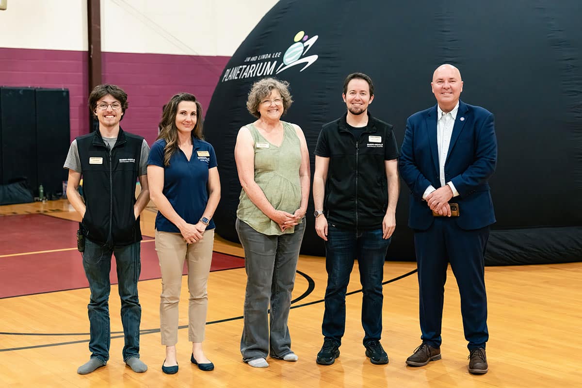 Members of Embry-Riddle and the Jim and Linda Lee Planetarium pose for a photo