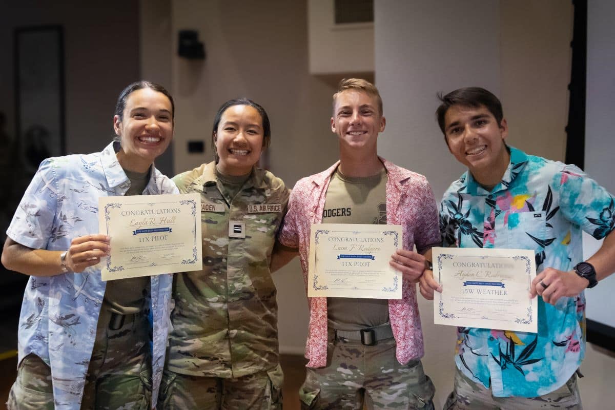 Air Force ROTC Detachment 028 cadets (from left) Layla Hull, Emma Layaoen, Liam Rodgers, and Ayden Rodriguez celebrate earning their assignments at Drop Night.
