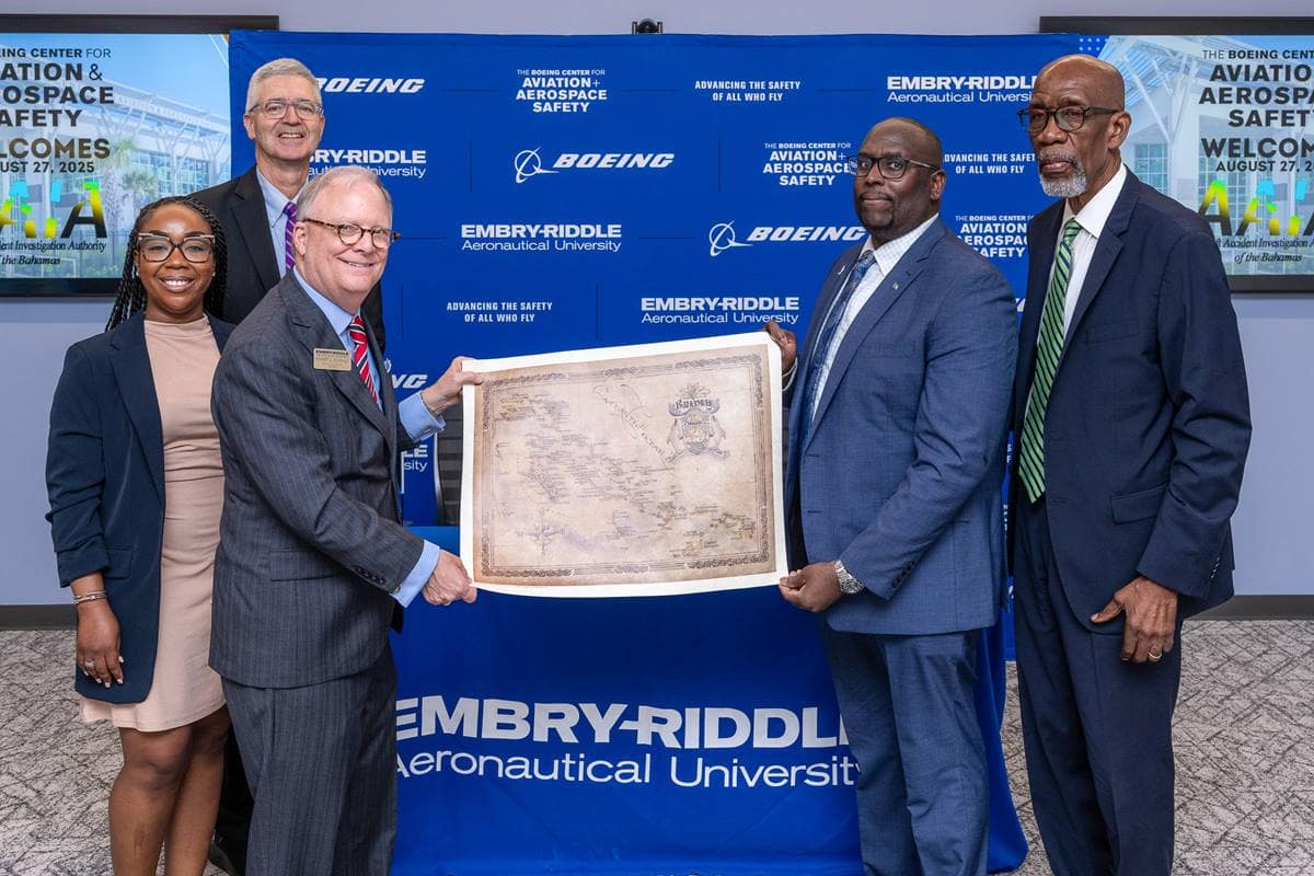 The AAIA of the Bahamas team presents a map to Sumwalt and Embry-Riddle President P. Barry Butler. The team includes (from left) Aviation Safety Analyst Symonne Cargil; Kendall Dorsett Jr., chief investigator of Air Accidents; and Captain Patrick Rolle, chairman of the AAIA of the Bahamas.