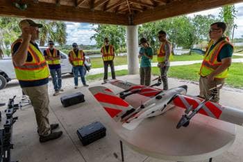 Embry-Riddle professor Dr. Dan Macchiarella talks to the team
