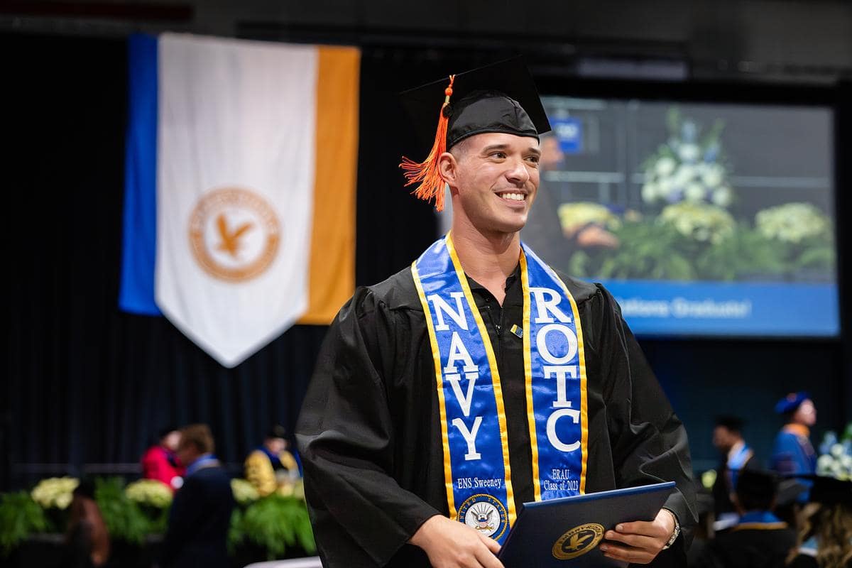 Man gets his diploma at Daytona Beach Graduation