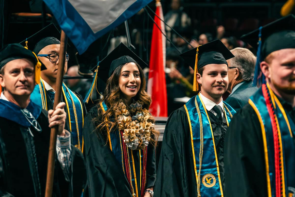 Graduates walk at ERAU Prescott graduation