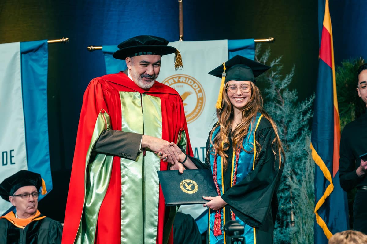 Woman accepts her degree at ERAU Prescott commencement
