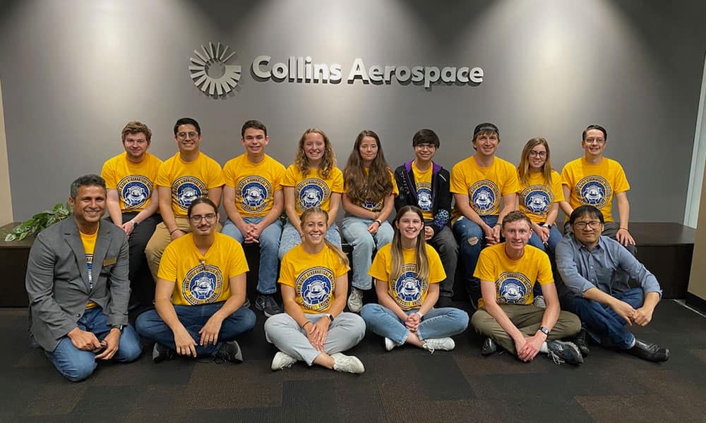 Dr. Krishna Sampigethaya (bottom left) and Professor Jesse Chiu (bottom right) pose with students from Embry-Riddle’s Prescott Campus at the Collins Aerospace facility in Cedar Rapids, Iowa.