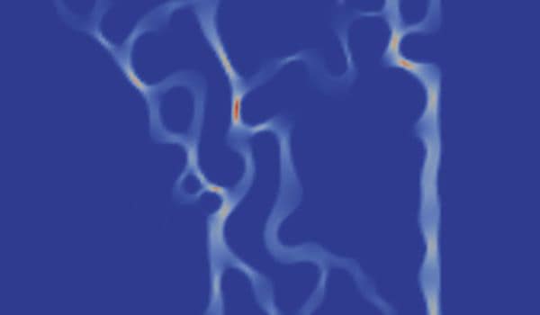 An example of conducting filaments spanning from the top to the bottom of a memristive-thin film.