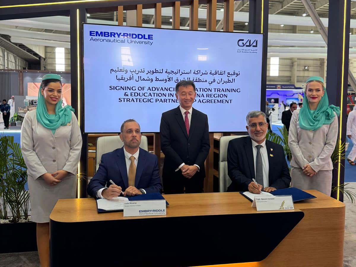 Luis E. Alcaraz, manager of Business Strategies for Embry-Riddle’s Worldwide Campus, and Captain Qasim Ismaeel, chief operating officer of Gulf Air, celebrate the signing of a training partnership agreement at the Bahrain International Airshow in November 2024