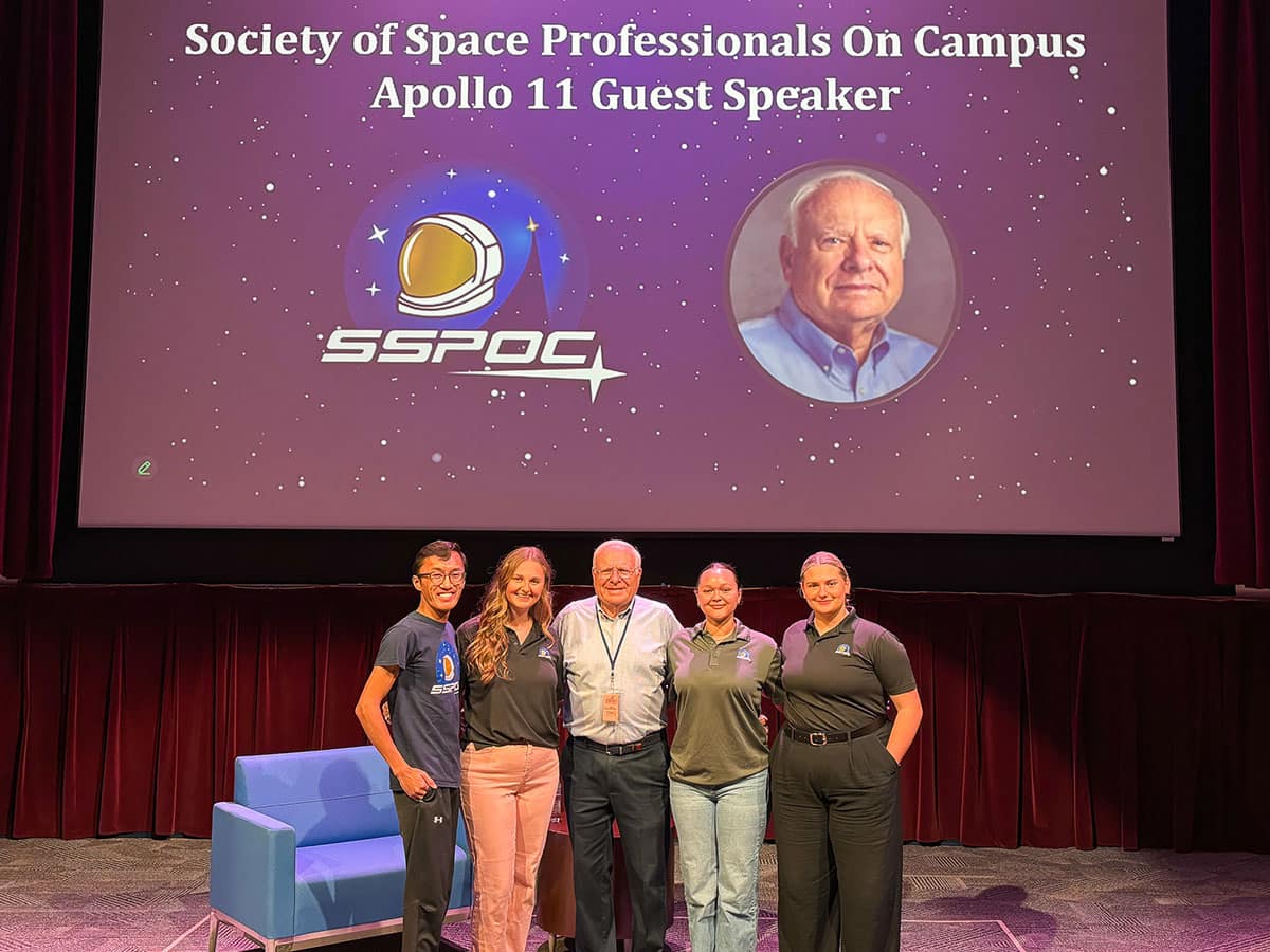 Members of Embry-Riddle’s Society of Space Professionals on Campus (SSPOC) pose with Apollo 11 flight controller Bob Nance