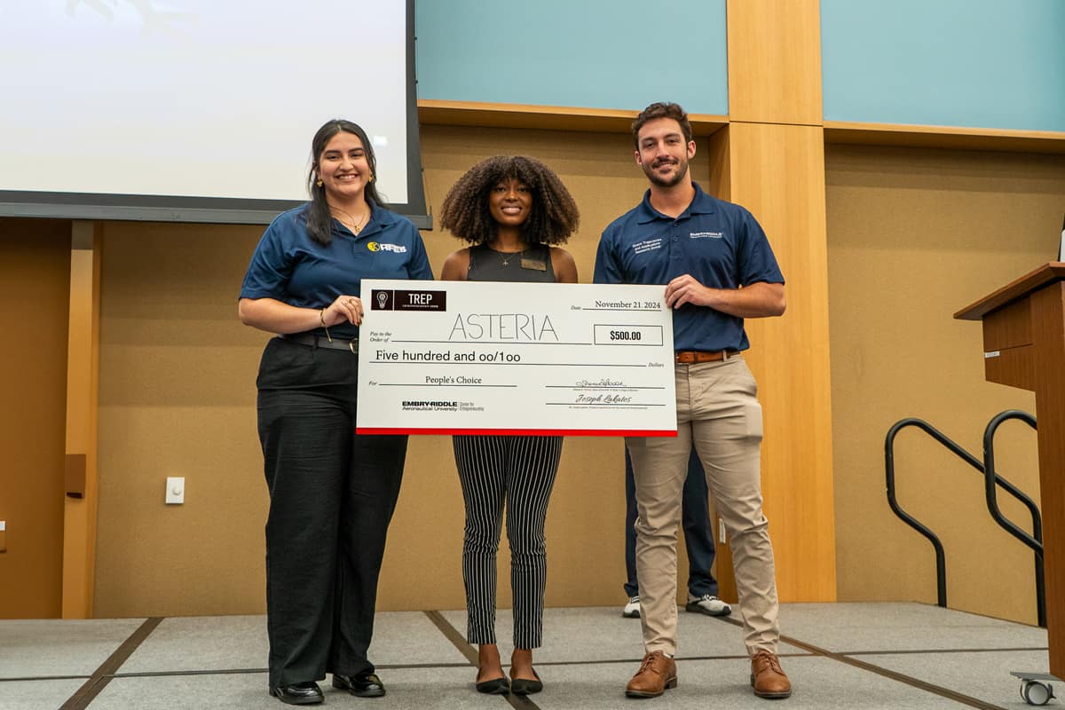 Asteria, represented by Ph.D. student Michelle Aros (left) and master’s student Joseph Anderson (right), won the People’s Choice Award.