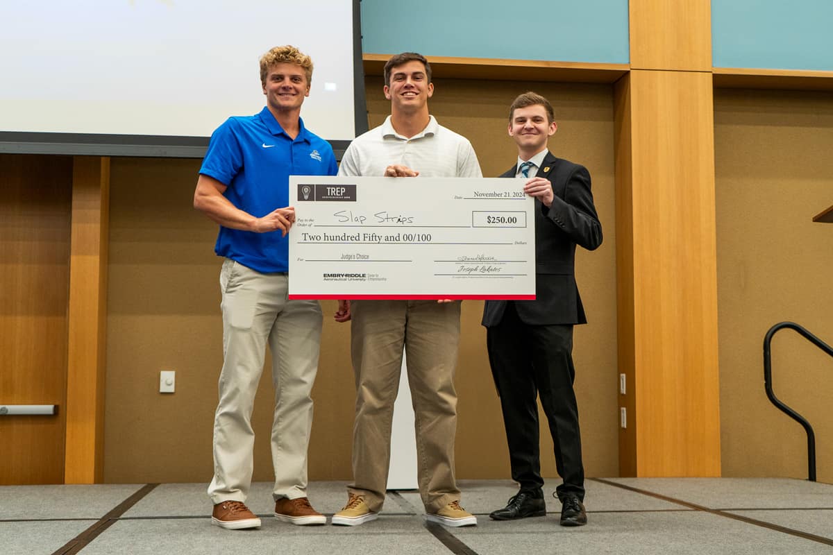 Slap Strips, represented by MBA student Ryan Flournoy (left) and undergraduate student Jacob Fleming (middle), won second place in the Incubation Track.