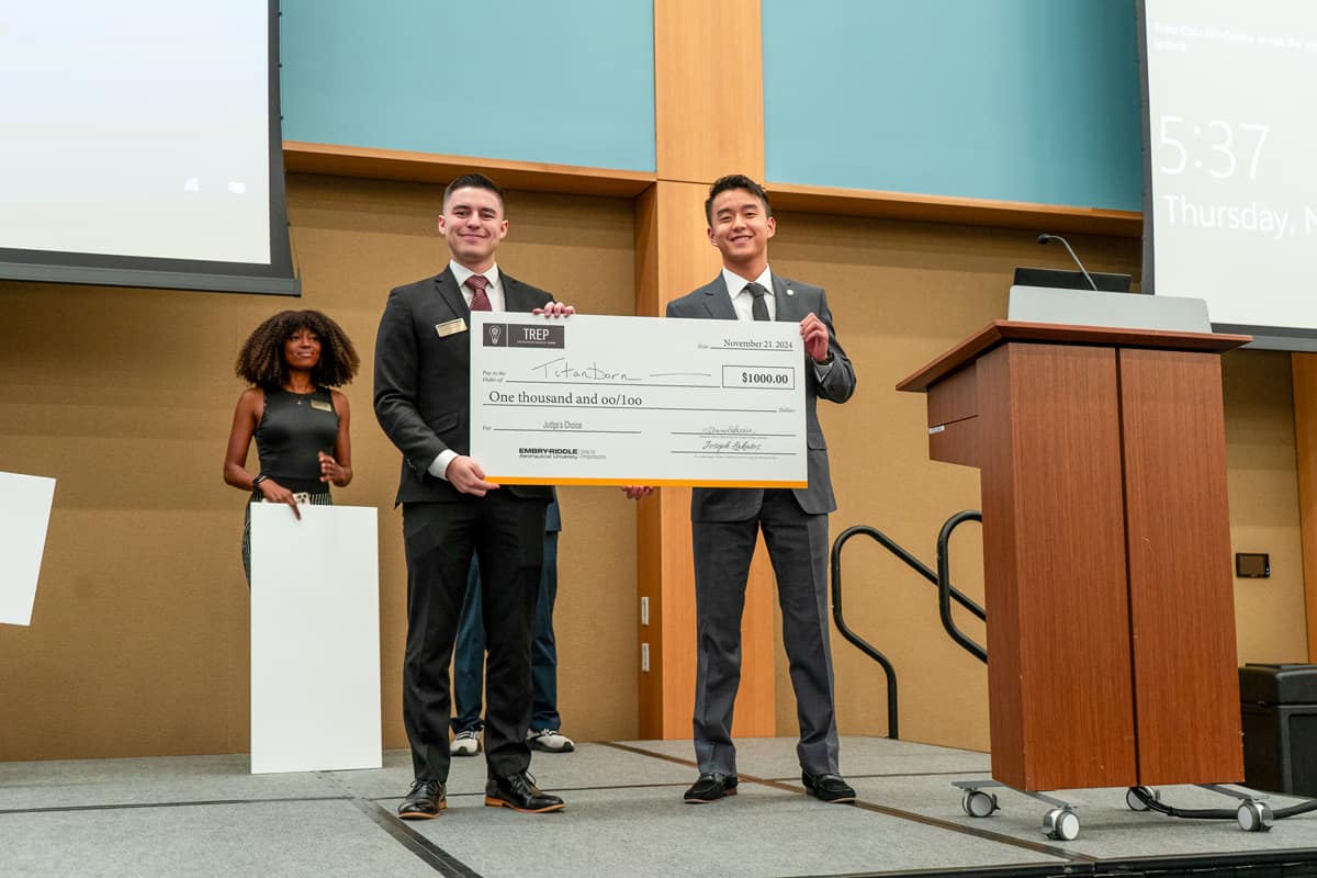 Titanborn, represented by undergraduate student Lucas Cohen (left), won second place in the Acceleration Track.