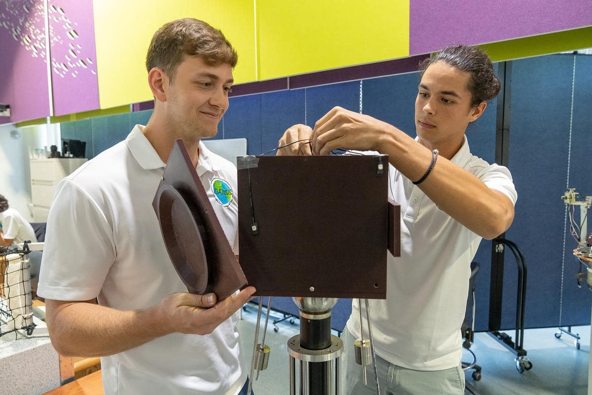 Spencer Johns and Pol Fontdegloria Balaguer work with the LIDAR device in the ADAMUS research lab 