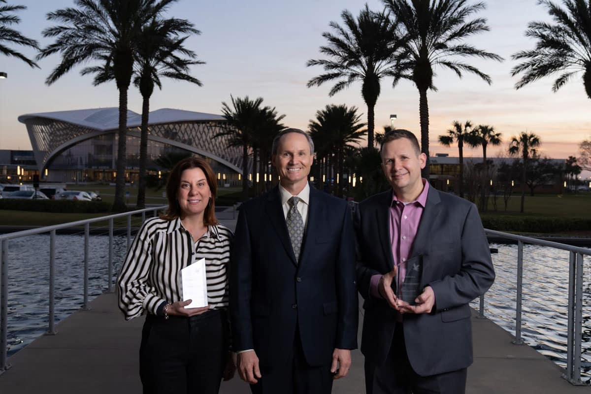 Aerospace Cybersecurity Excellence award winners Deneen DeFiore and Patrick Morrissey flank Dan Diessner, director of Embry-Riddle's Center for Aerospace Resilience