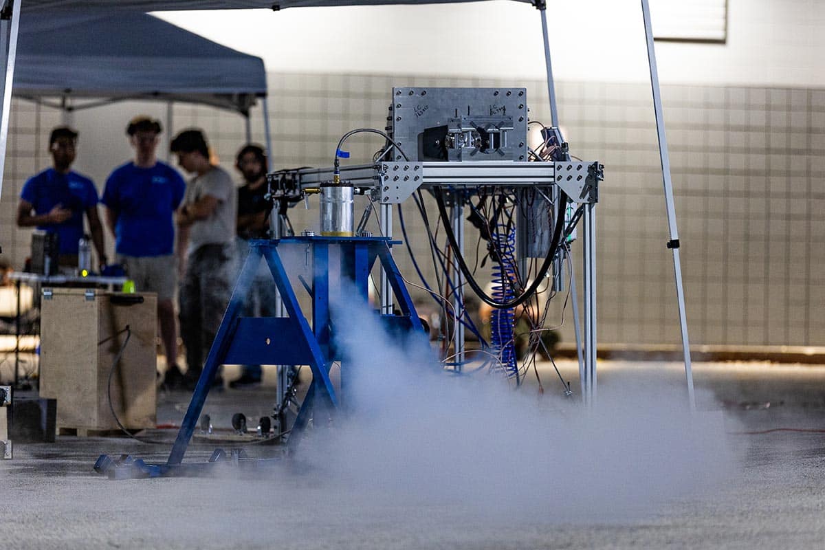 Experimental Rocket Propulsion Laboratory students set up their hardware in preparation of an injector test