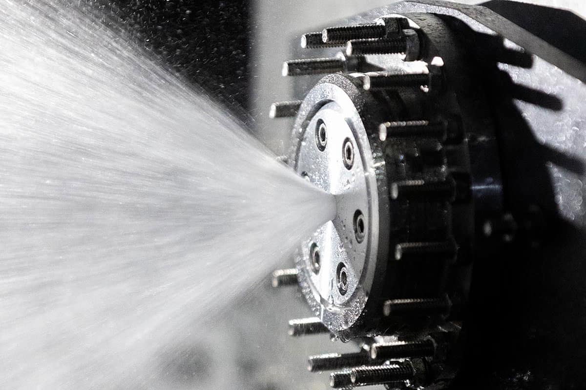 An injector for one of the team’s hybrid rocket engines undergoes a water test