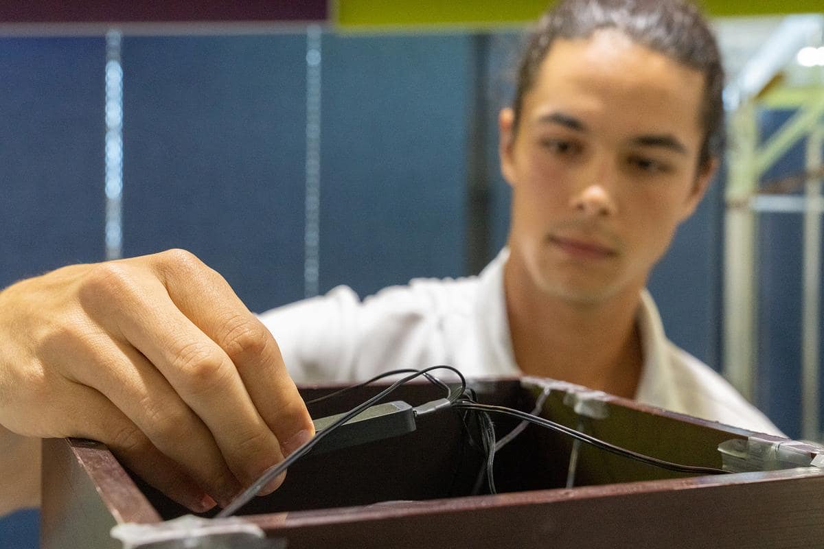 Pol Fontdegloria Balaguer works with a LIDAR device in the ADAMUS research lab