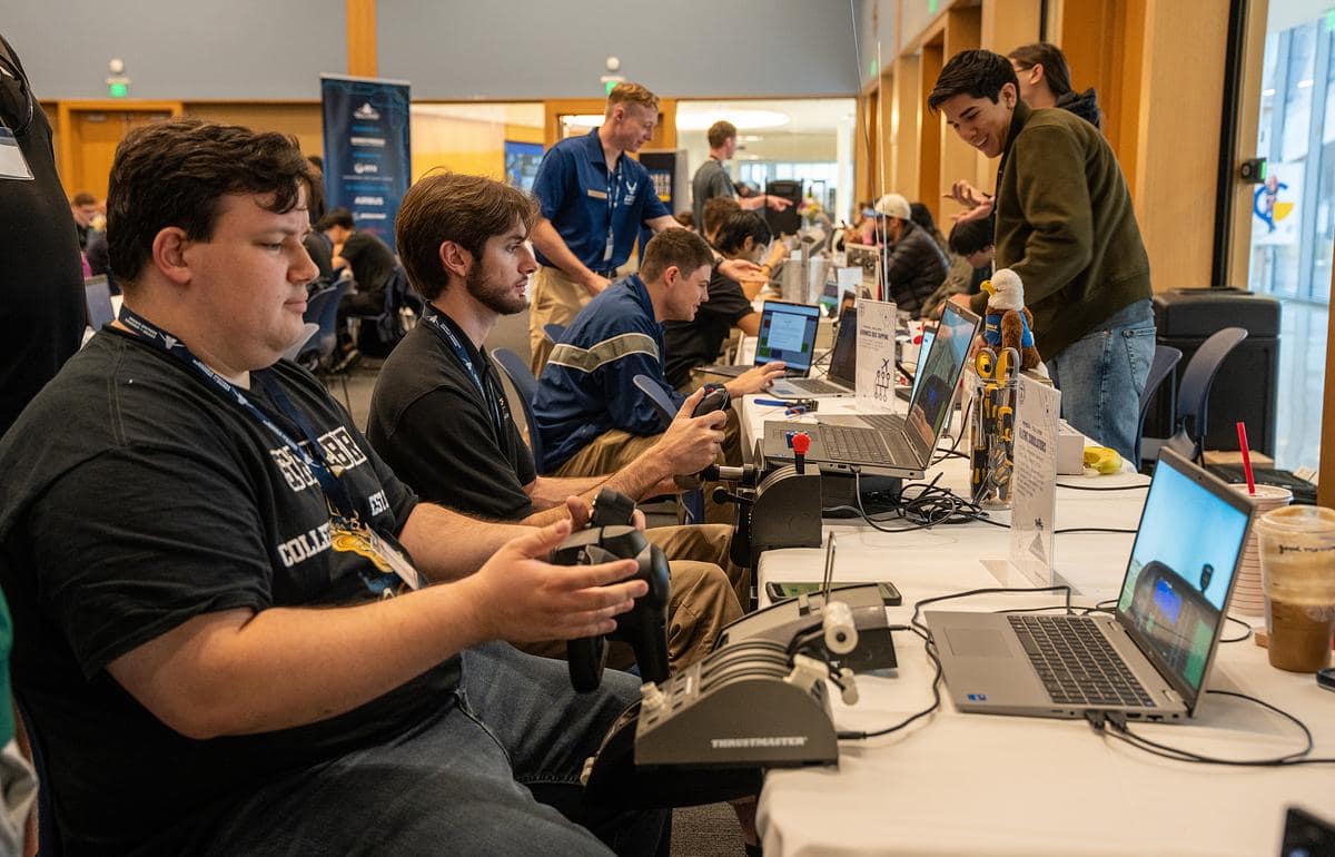 Students sit in front of computers participating in a capture-the-flag competition at Embry-Riddle